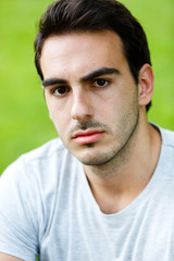 Fototapeta premium Potrait of attractive man in nature on daylight