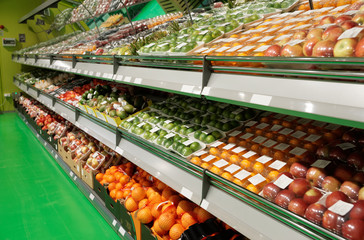 Shelves with fruits in supermarket