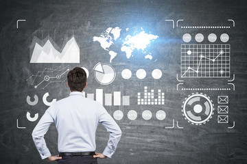 Man looking at blackboard, graphs © ImageFlow