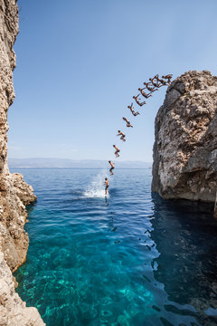 sequence shot of a young boy jumping off a cliff into the sea