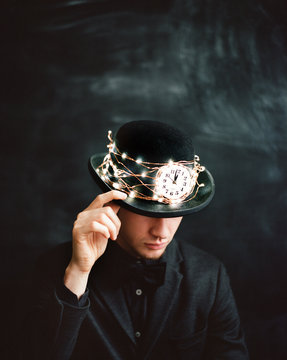 Man in hat wrapped with garland 