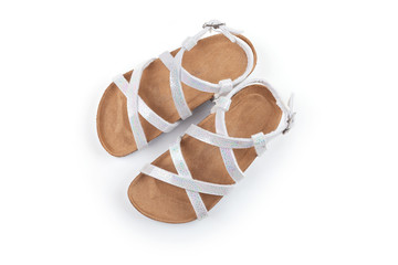 Pearly white children sandals, isolated on white