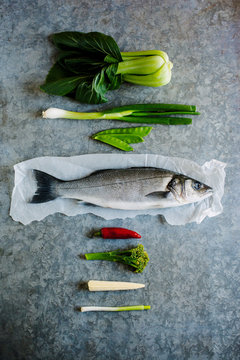 Line caught sea bass and ingredients for cooking it with