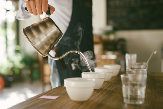 Young man making experiment on coffee and comparing