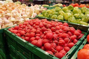 Red radish and another vegetables in grocery store