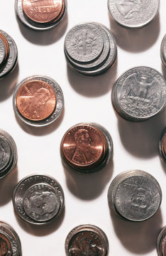 Overhead view of coins on white background