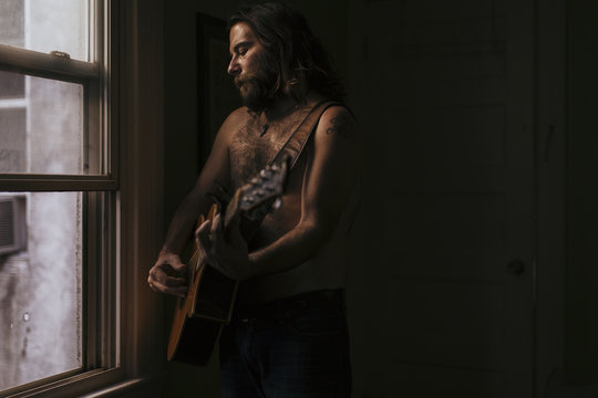 A musician plays his soulful guitar 
