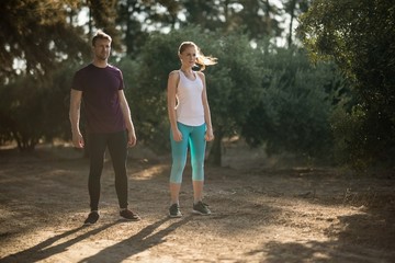 Obraz premium Determined young couple standing on field at farm