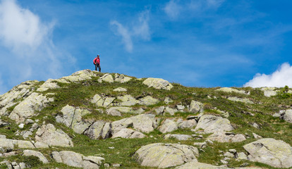 Naklejka premium Trekker walking along a ridge.