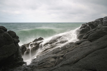 Fototapeta na wymiar View of seacoast with cliffs.