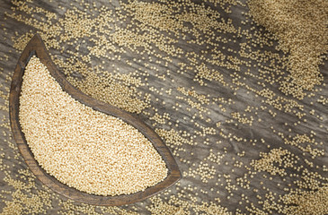 Amaranth seeds on the wooden table (Amaranthus)