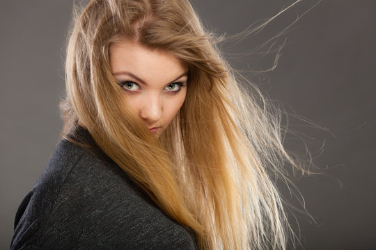 Attractive blonde woman with windblown hair