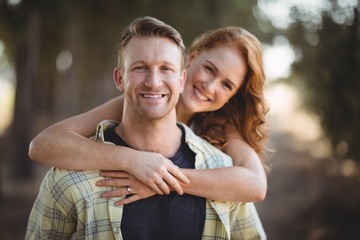 Fototapeta premium Smiling young couple at olive farm