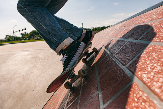 Skateboarder Comes Across Brick Wall At Angle