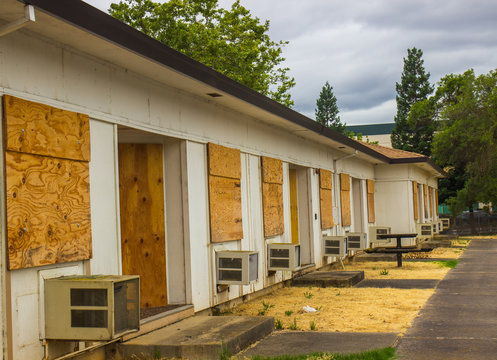 Abandoned Units With Boarded Up Windows & Doors