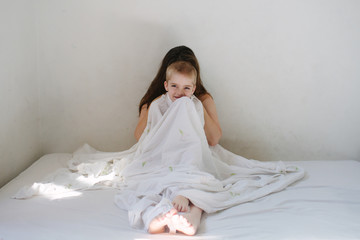 Mother's face obscured by her child's head