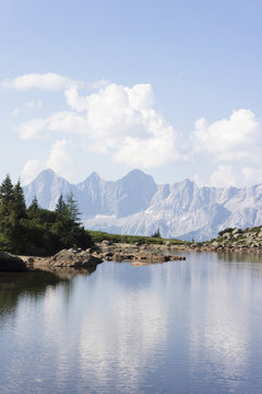 Lake Spiegelsee with mountain Dachstein on Reiteralm, austria