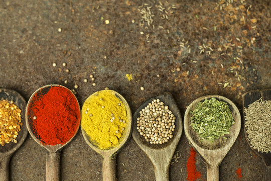 Colourful spices on the spoons