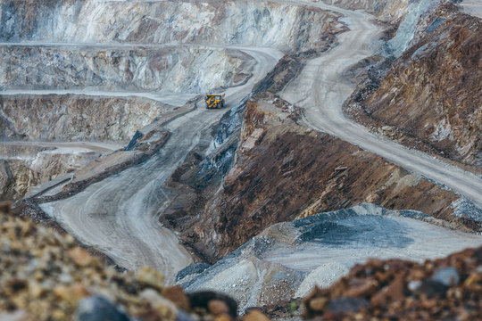 yellow quarry truck in strip mining construction site