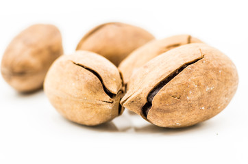 pecan nuts in a shell on the white background