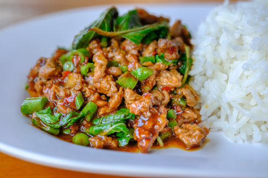 fried beef with basil and rice in dish