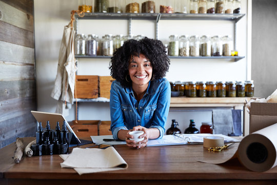 Millennial African American Woman businesswoman in her skincare studio