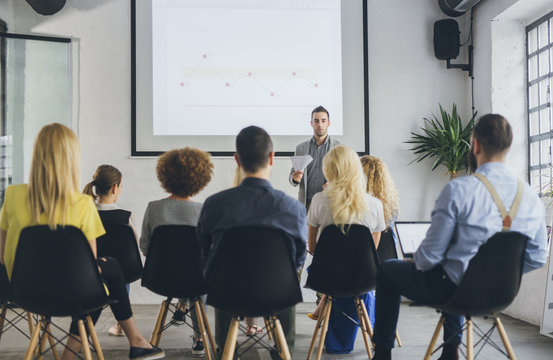 Businessman giving a presentation to colleagues