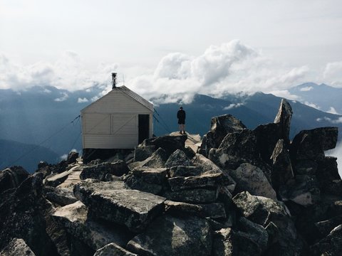 Young man next to cabin