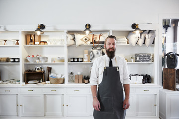 Hipster millennial small business owner in artisan retail store