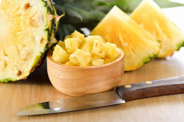 pineapple sliced on wood background