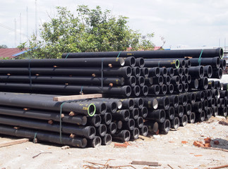 Underground sewerage pipe stacking at the storage area in the construction site. 