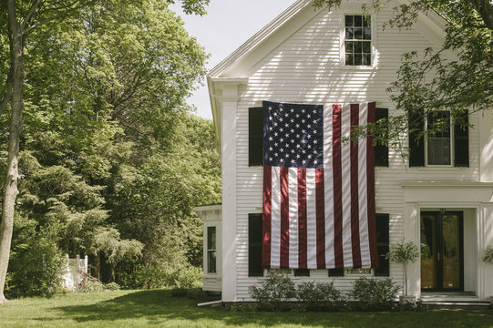 American flag hanging outside the house