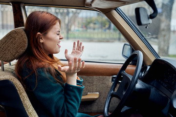 Woman driving a retro car, young woman driving a car