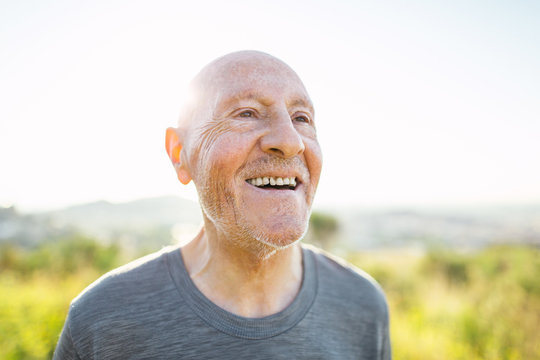 Portrait of a smiling senior man in the mountain