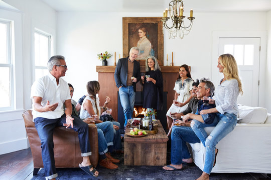Group of friends and family having a cocktail party in their home