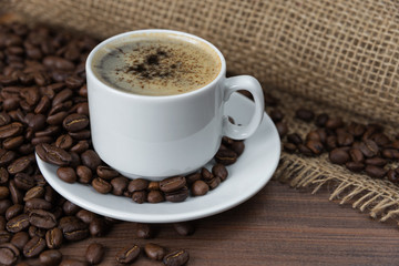 Cup of coffee and coffee beans