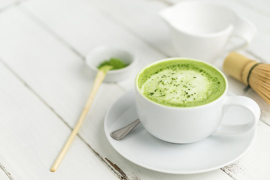 Green tea matcha latte cup with copyspace. This latte is a delicious way to enjoy the energy boost & healthy benefits of matcha. Matcha is a powder of green tea leaves packed with antioxidants.