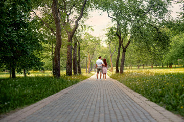 Family love couple in the forest park  on a Fairy tale road