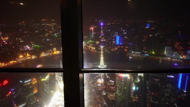 aerial view of Shanghai night-scene from huanqiu sightseeing hall,urban landscape,high-rise buildings & urban traffic,orient pearl tower.