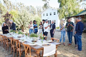 Group of friends enjoying cocktails at an outdoor party