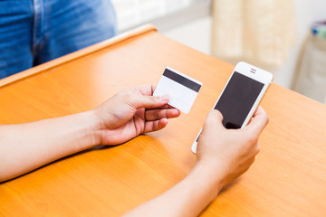 Businesswoman check the telephone number on a cards