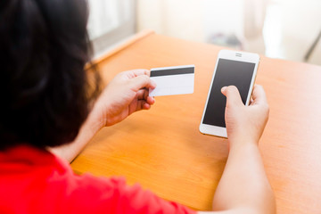 Businesswoman check the telephone number on a cards