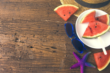 sunglasses with melon and hat with starfish in summer