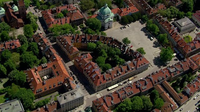 Aerial view of Warsaw old town buildings with traditional red roofs, Poland. Old urban square