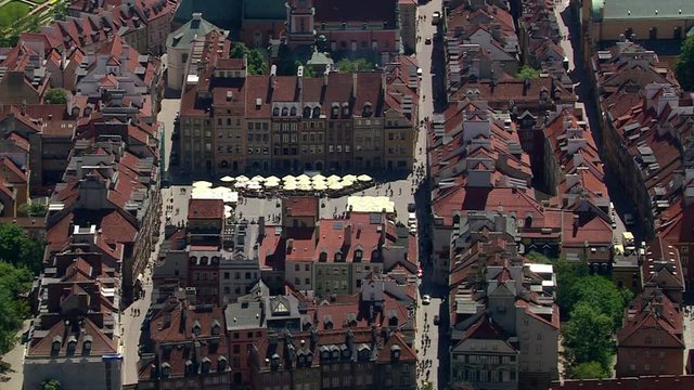 Aerial view of Warsaw old town square buildings with traditional red roofs, Poland