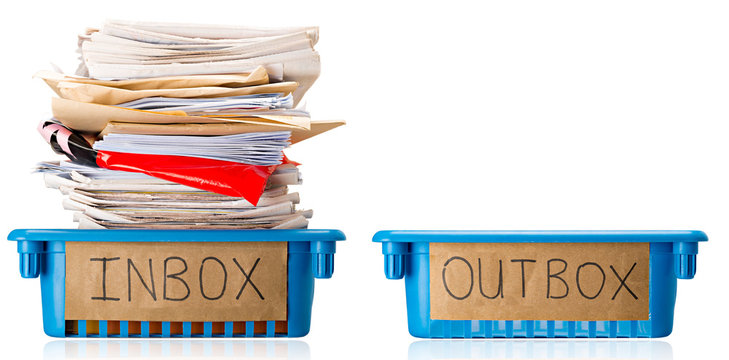 Procrastination - A Full Inbox Tray And An Empty Outbox Tray - Overwhelmed - Isolated On White Background