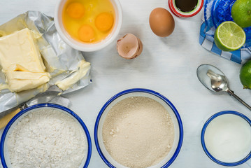 Ingredients for lime cake on white background