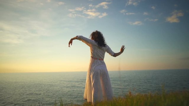 Young free beautiful healthy woman practice yoga dance sunrise slow motion