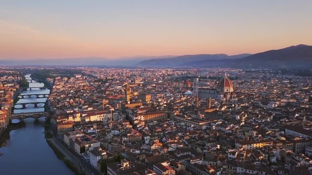 florence aerial shot at sunrise flying over city center cut two
