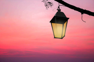 vintage lantern on red sky background